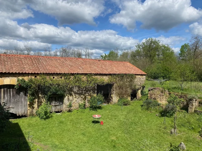 Nice Stone Property Including a Main House, a Separate Apartment, a Large Stone Barn, and Outbuildings, all Set on a Bea… photo 2
