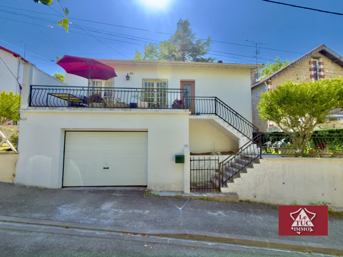 House with Large Garage, Terraces and Garden.