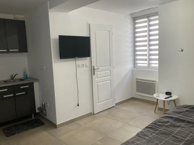 In Lagnieu, in the Town Center, a Building with Two 2-Bedroom Apartments. photo 2