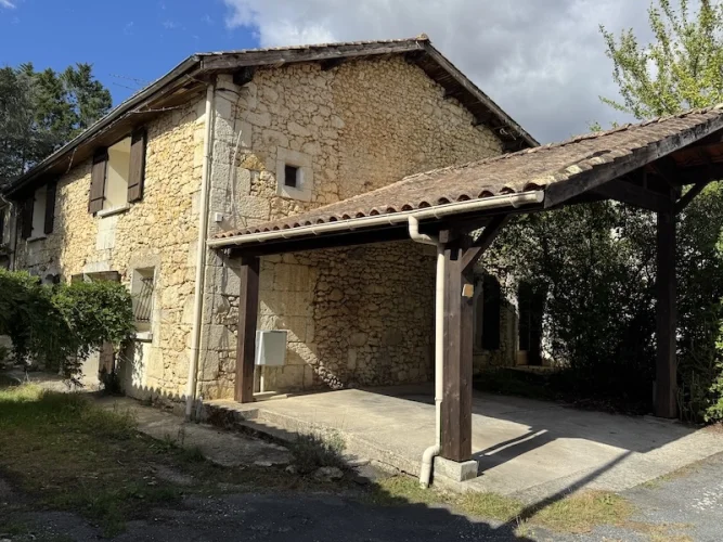 Pretty stone house with garden and an old barn