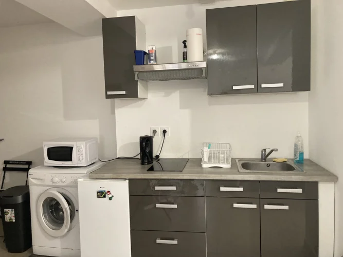 In Lagnieu, in the Town Center, a Building with Two 2-Bedroom Apartments.
