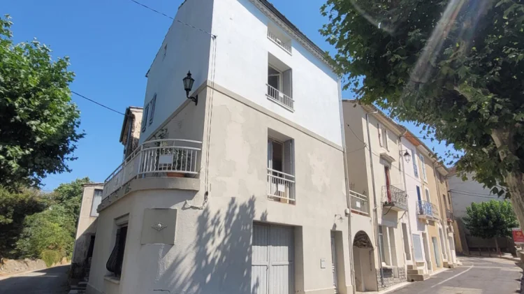 A Charming Sunny Village House with a Garage, Terraces and a Balcony.